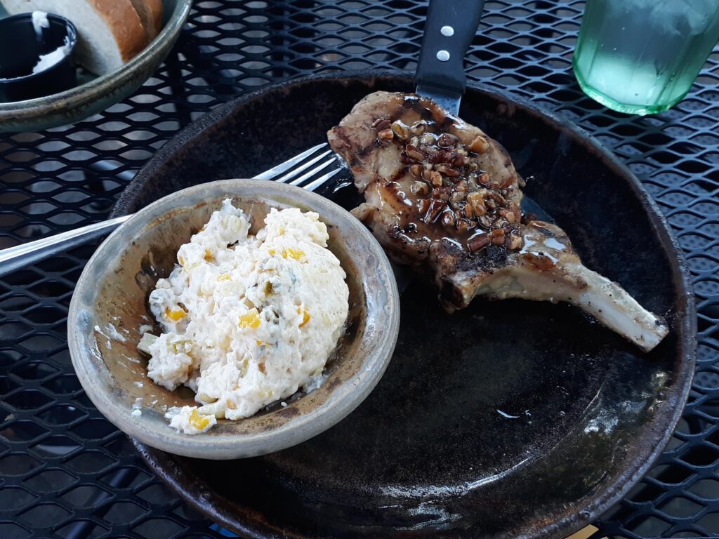 Want fancy southern cooking?  How about jalapeno corn pudding and maple pecan pork chop.  Outstanding!